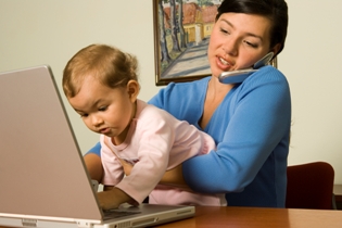 Image of woman and child on laptop